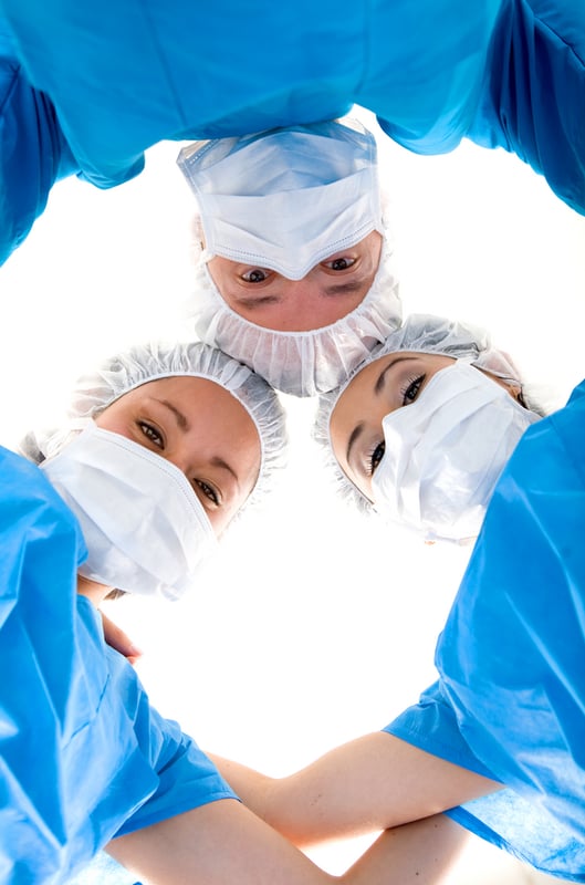 Medical Team in Blue over a white background Medical Team in Blue over a white background